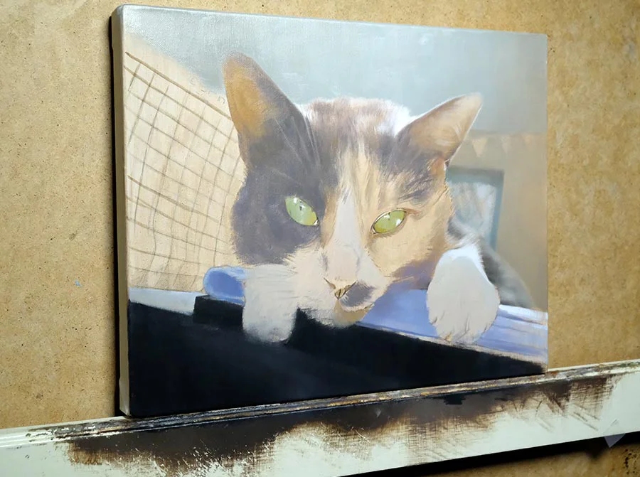 Mitzy's cat oil painting in progress, showing the initial brushwork and composition on canvas.