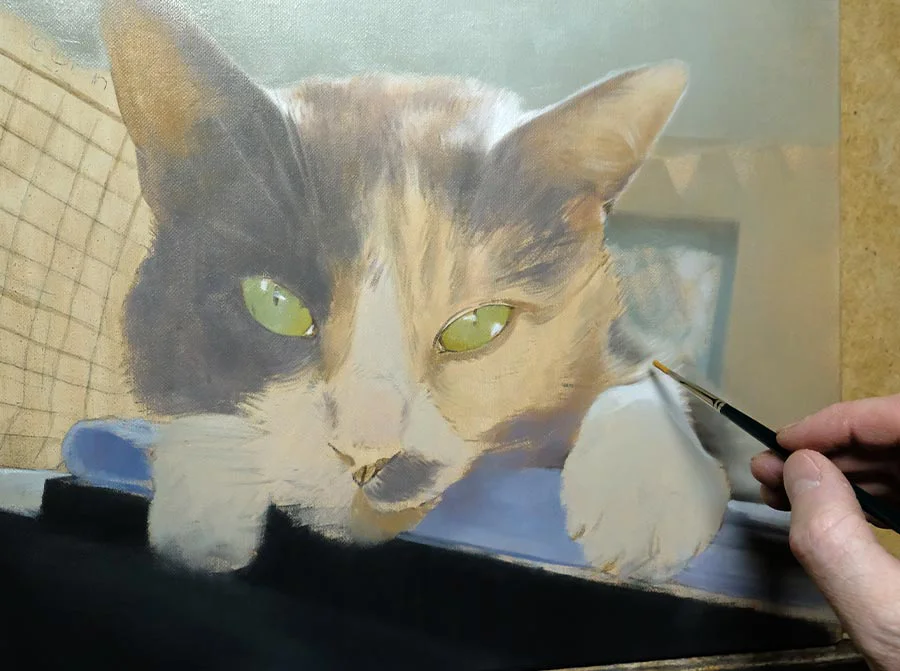 Close-up detail of Mitzy's cat portrait painting in progress, focusing on eye and fur development.