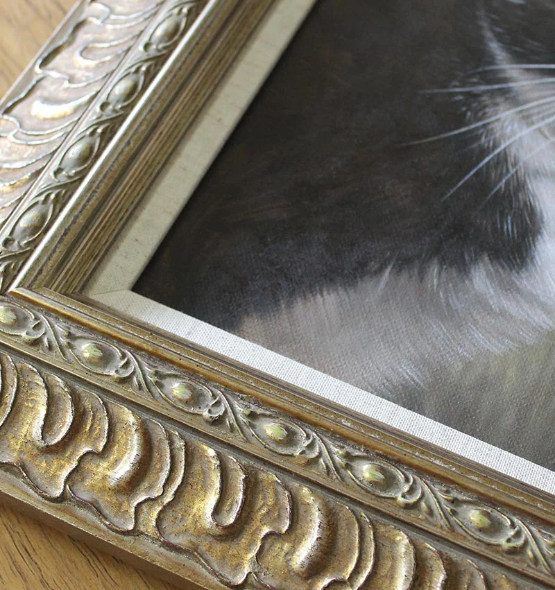 Purdy's cat oil portrait, framed and beautifully displayed in a home environment.
