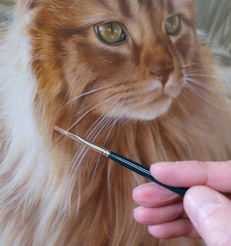 Close-up of Roly's cat portrait painting in progress, showing detailed fur textures.