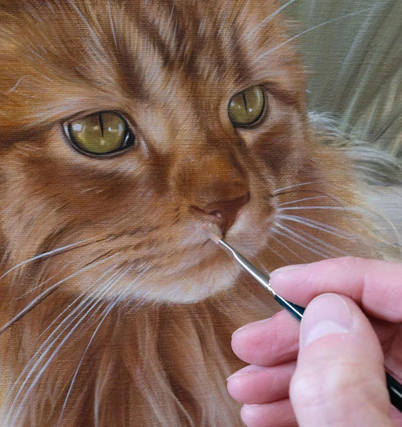 Roly's cat portrait painting on an easel, showing an advanced progress stage.