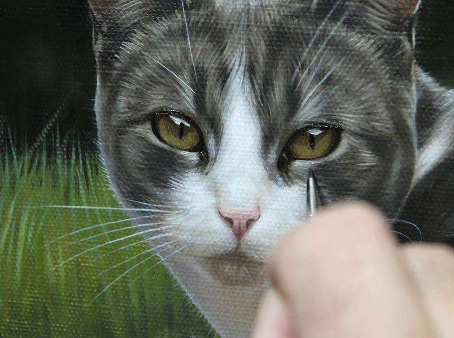 Close-up of Nicholas's brushwork on the cat portrait, showing detailed fur texture.