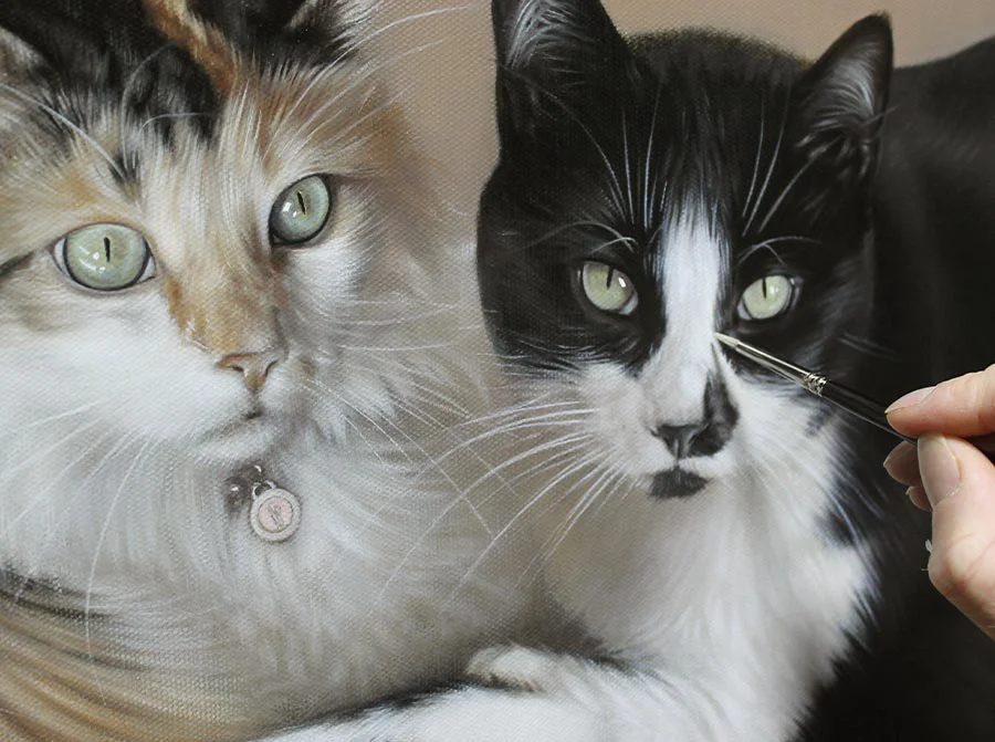 Close-up detail of Ginger and Maggie's cat portrait, focusing on fur and eyes.