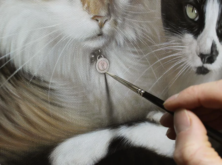 Tight close-up of Ginger and Maggie's cat oil painting, highlighting texture and brushstrokes.