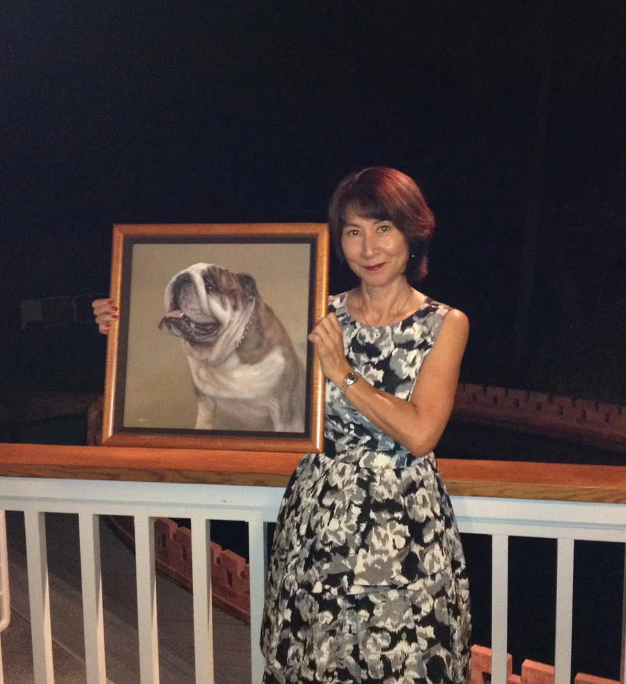 Another view of the Bull Dog oil portrait displayed on an easel.
