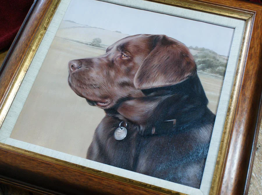 Framed oil portrait of Flag, a chocolate Labrador, showcasing the elegant wood frame and linen slip.