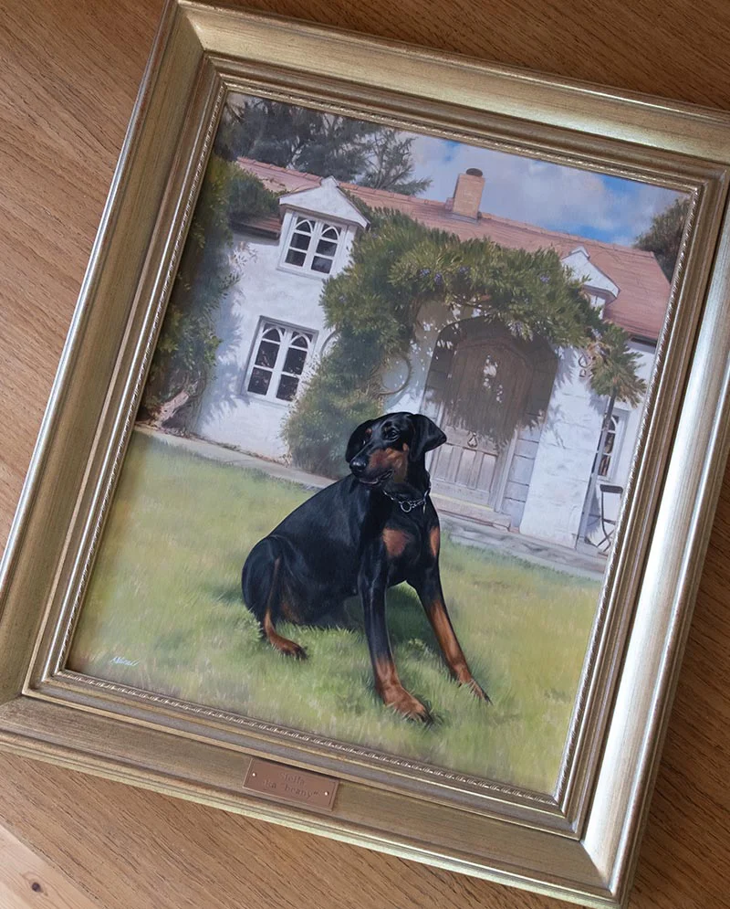 Dog Oil Painting Framed and Ready to Hang A professionally framed oil painting of Stella the Doberman, showcased upright and ready for hanging, emphasizing the finished artwork.