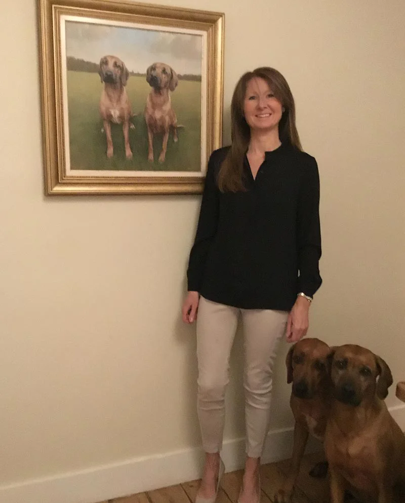 Clients with Their Rhodesian Ridgeback Portrait, a moment of joy Clients proudly posing with their newly commissioned Rhodesian Ridgeback portrait