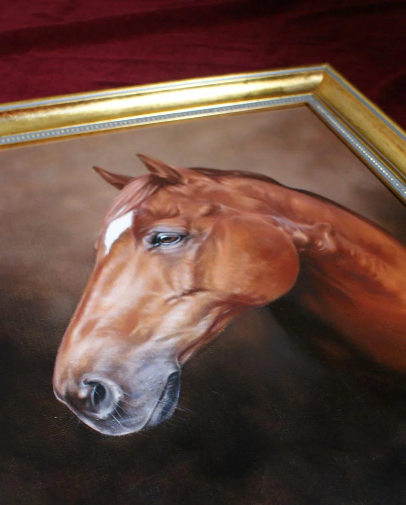 Oil portrait of George framed and displayed in a home setting.