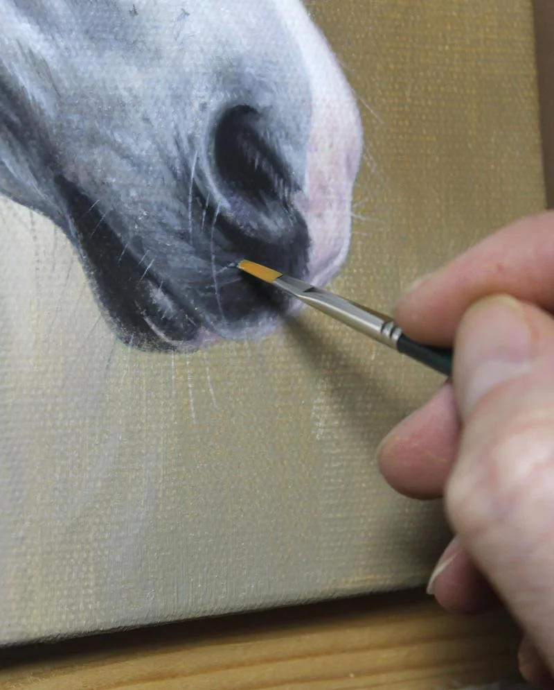An even closer view of the horse oil painting in progress, focusing on the refined details of Artu's face and expressive features.