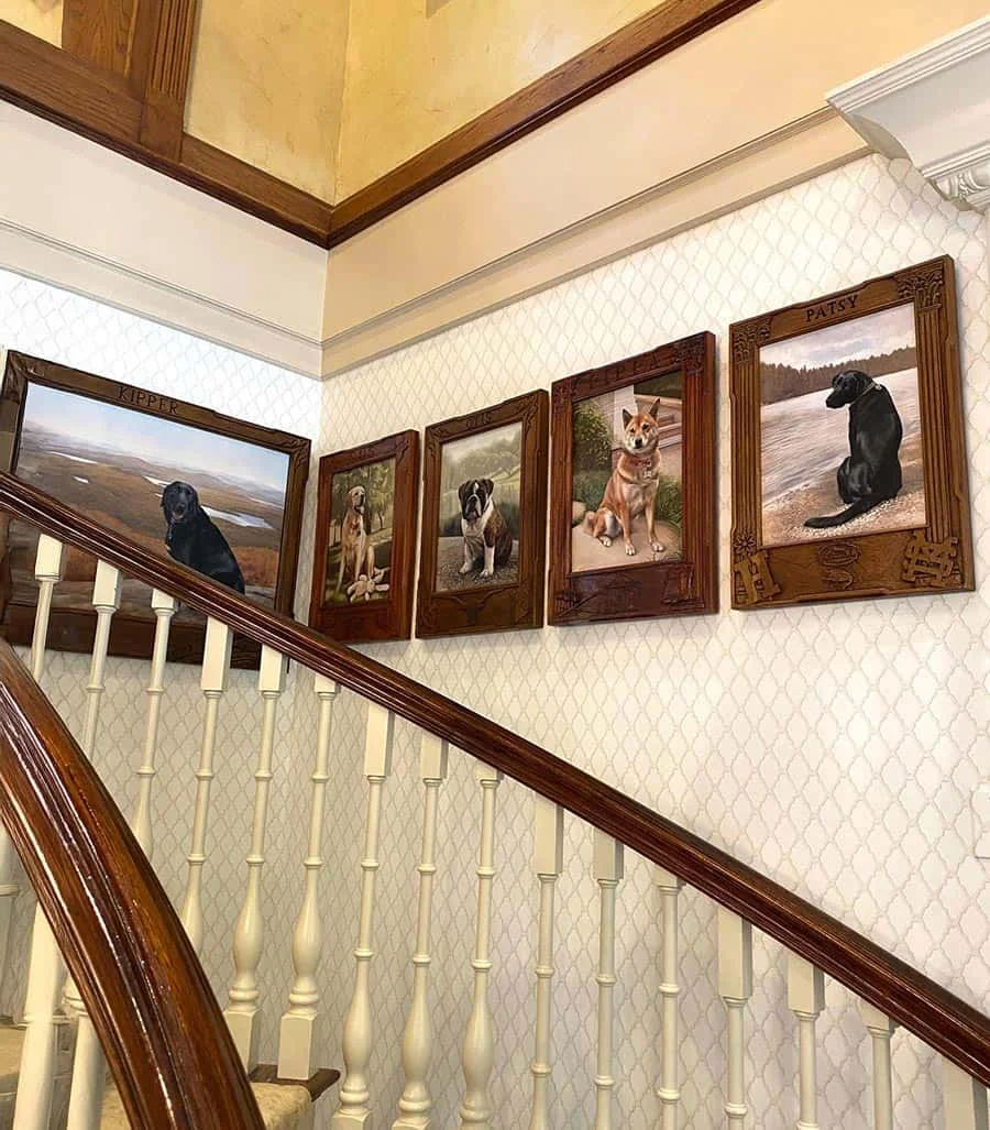 Harlan Crow's curated collection of dog oil portraits by Nicholas Beall in his Dallas residence A series of five custom oil portraits of various dogs, elegantly displayed on a stairwell wall within a home, by Nicholas Beall.