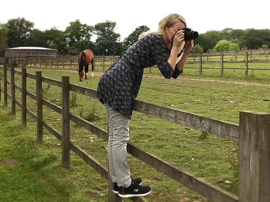 Melanie taking reference photos of horses for pet portraits