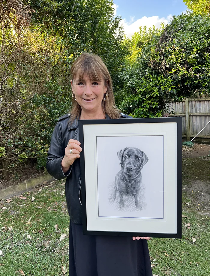 Jaqueline Pentelow with Emrik's Portrait The pet portrait of Emrik being held by its owner Jaqueline Pentelow from Australia