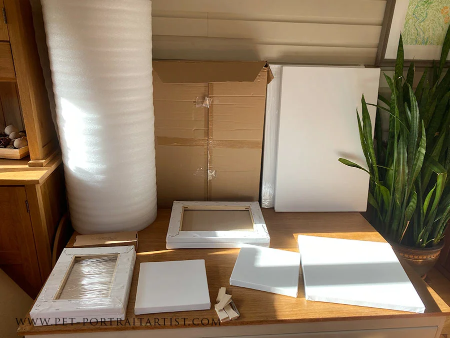 New Canvases Delivered to the Studio for Commissions A fresh delivery of multiple custom-sized canvases stacked in the studio, indicating new pet portrait commissions are ready to begin.