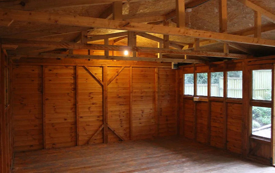 Starting the Studio Renovations - Floor First! The initial stage of the studio renovation, showing the old workshop interior with the floor removed for insulation.