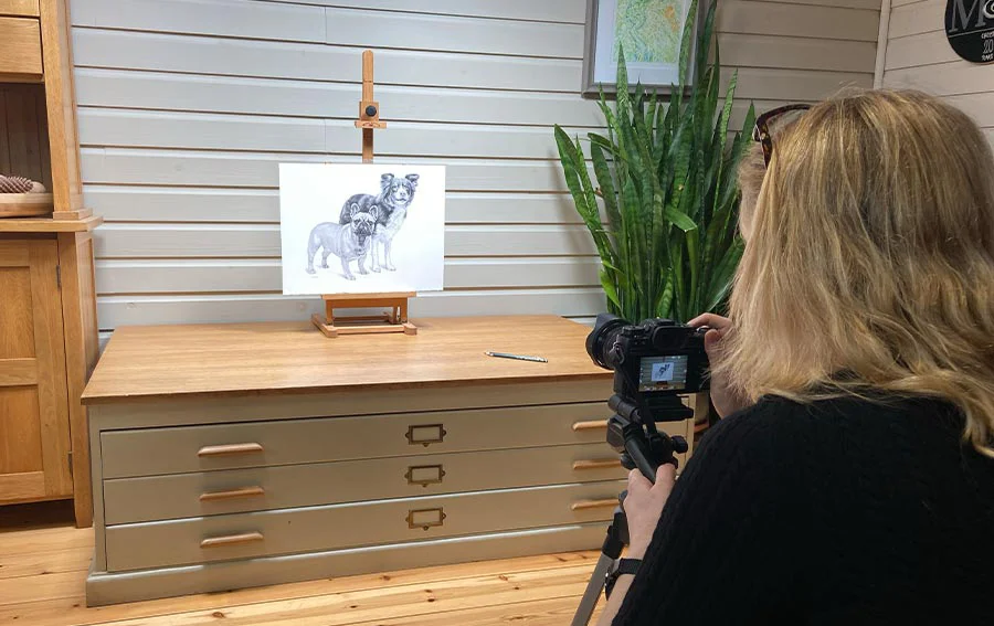 Photographing a Dog Portrait for a French Commission Melanie photographing a custom dog portrait on the studio's vintage plan chest, destined for a French dog food label.