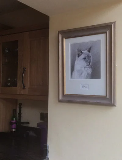 Rebecca's Cat Portrait Testimonial A lifelike cat portrait proudly displayed in Rebecca's home, making the pet feel present in the living space.