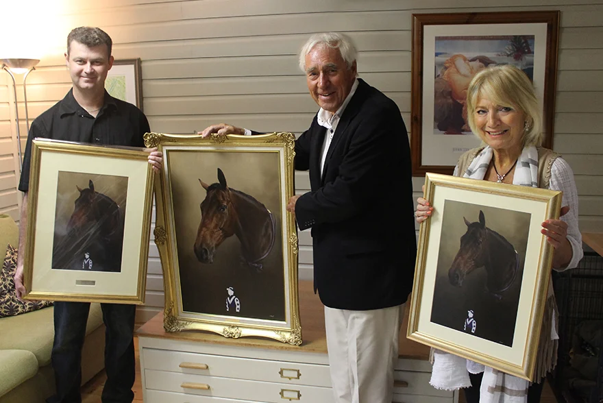 Ted and Janice Collecting Ballycastle King's Portrait Ted and Janice, returning clients, smiling in the studio with their newly collected framed oil painting of Ballycastle King and a framed print.
